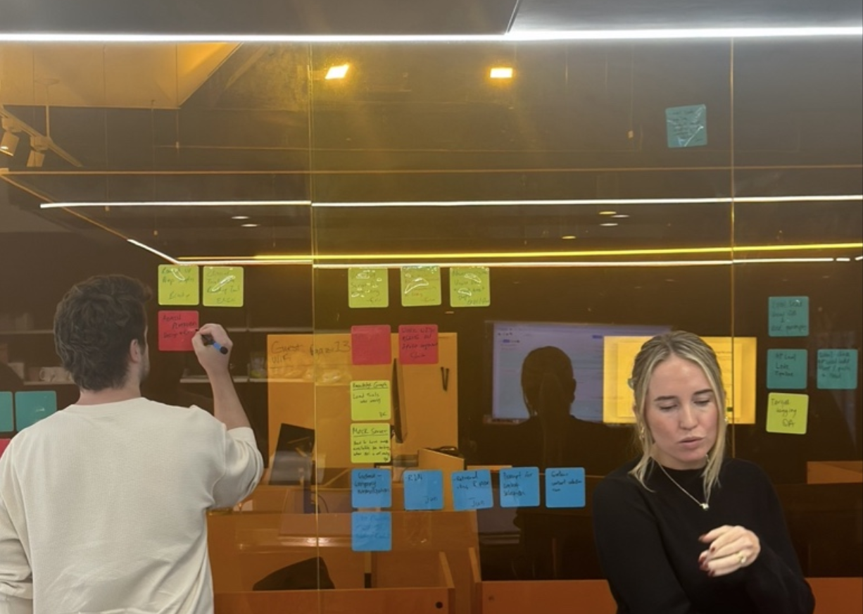 AppliedXL team planning session at a glass board